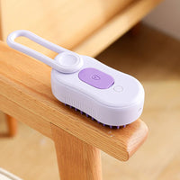 Cepillo de vapor lila visto por detrás, con su botón de vapor